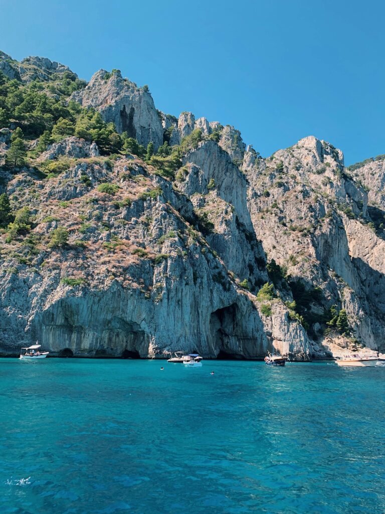 pexels-photo-2928024-2928024 Breathtaking view of hills and clear blue waters in Capri, perfect for summer travel.